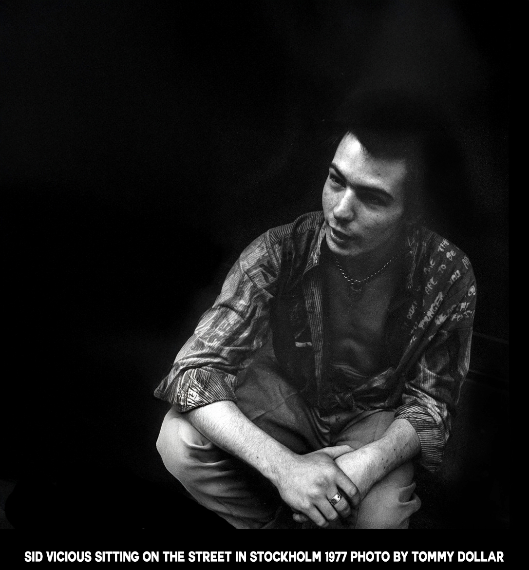 Sid Vicious sitting on the street  copy